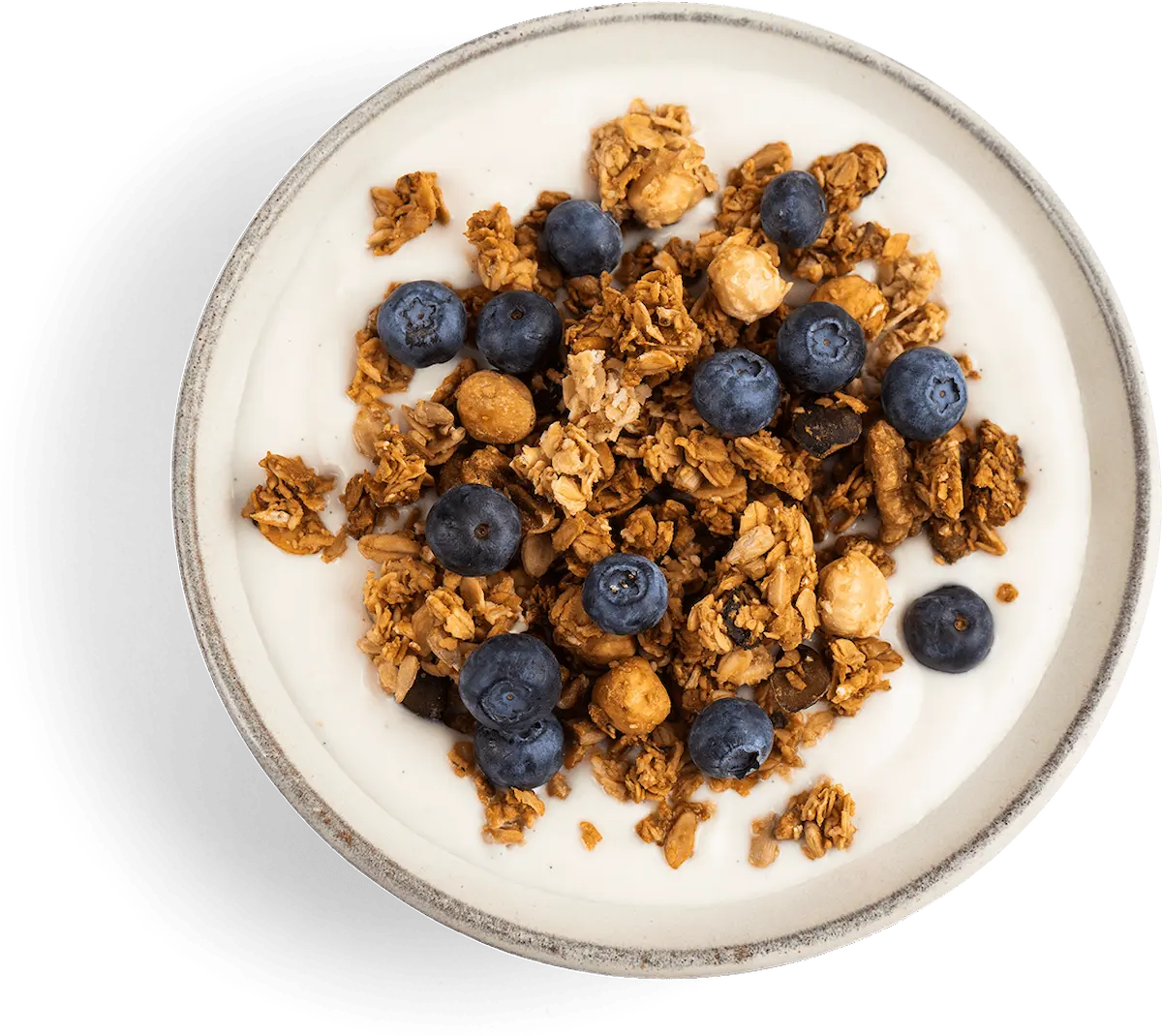 Verdens beste granola servert med friske blåbær på frokost-tallerken. Hjemmelaget frokostblanding uten sukker fra Imres Granola. Perfekt kombinasjon med synnøve gresk yoghurt vanilje for en sunn frokost. Når du blander med yoghurt får du også et godt proteintilskudd.